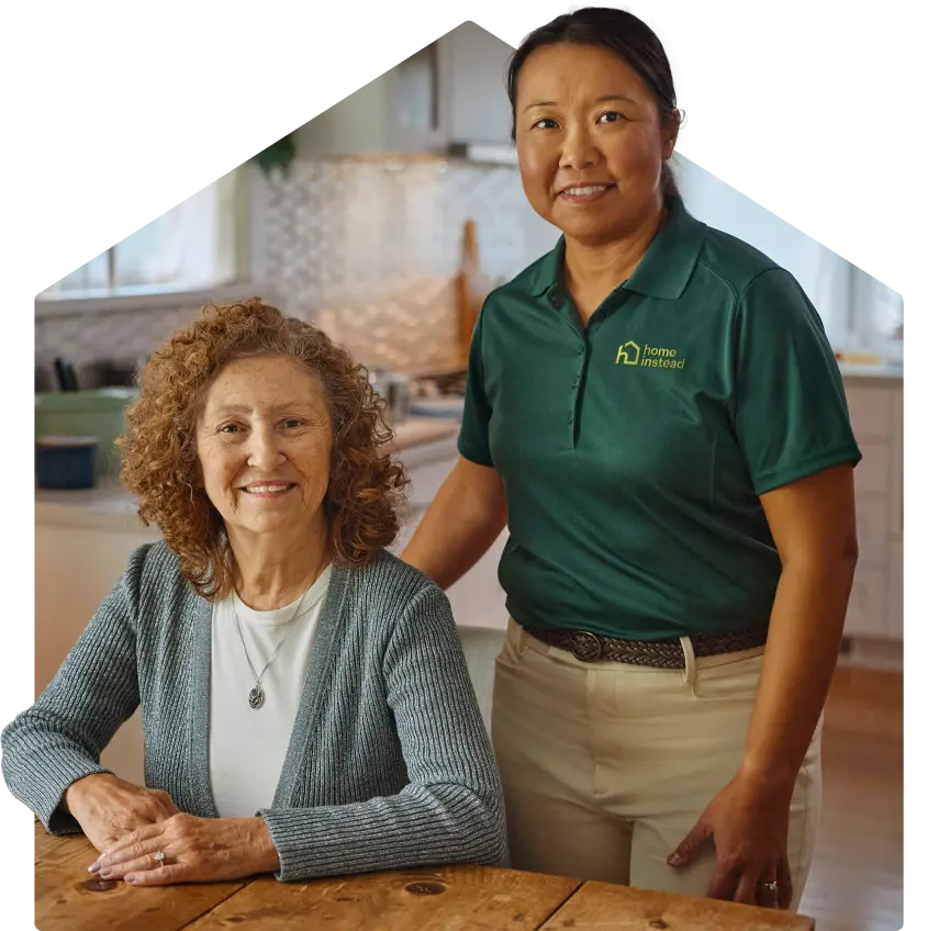 A Home Instead Care Pro with an adult.